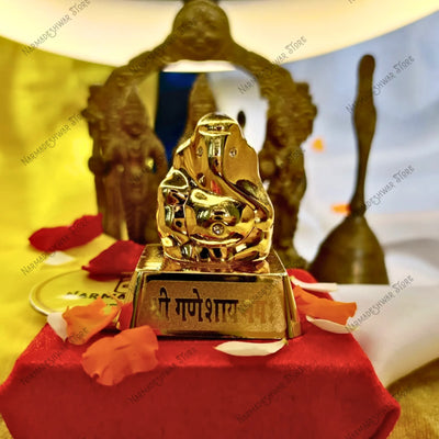 Golden Ganesh idol, small Ganesh idol for puja, Lord Ganesha decorative idol, Ganesh idol for home temple, Vedic Ganesh worship idol, sacred Ganesh spiritual item, Narmadeshwar Store Ganesh idol, Narmadeshwar Store spiritual idols, Narmadeshwar Store puja items, authentic products by Narmadeshwar Store, Narmadeshwar Store Vedic spiritual products, Narmadeshwar Store Hindu spiritual items
