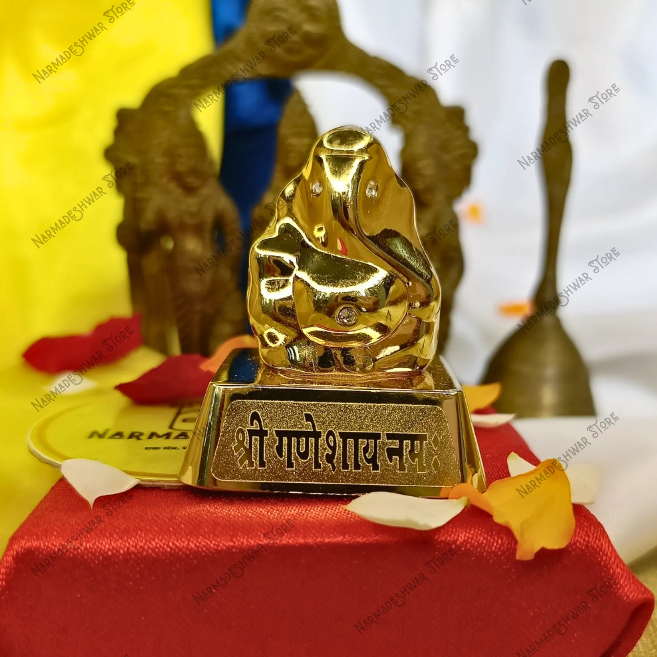 Shri Ganeshay Namah Golden Ganesh Murti Vedic Energized Idol with blurred background