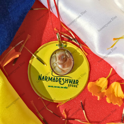 Gomati Ganesh pendant, original Gomati Ganesh necklace, Gomati Ganesh for puja, sacred Gomati Ganesh idol, Gomati stone Ganesh pendant, traditional Gomati Ganesh spiritual item, Narmadeshwar Store Gomati Ganesh, Narmadeshwar Store spiritual pendants, Narmadeshwar Store puja items, authentic products by Narmadeshwar Store, Narmadeshwar Store Vedic spiritual products, Narmadeshwar Store Hindu spiritual items