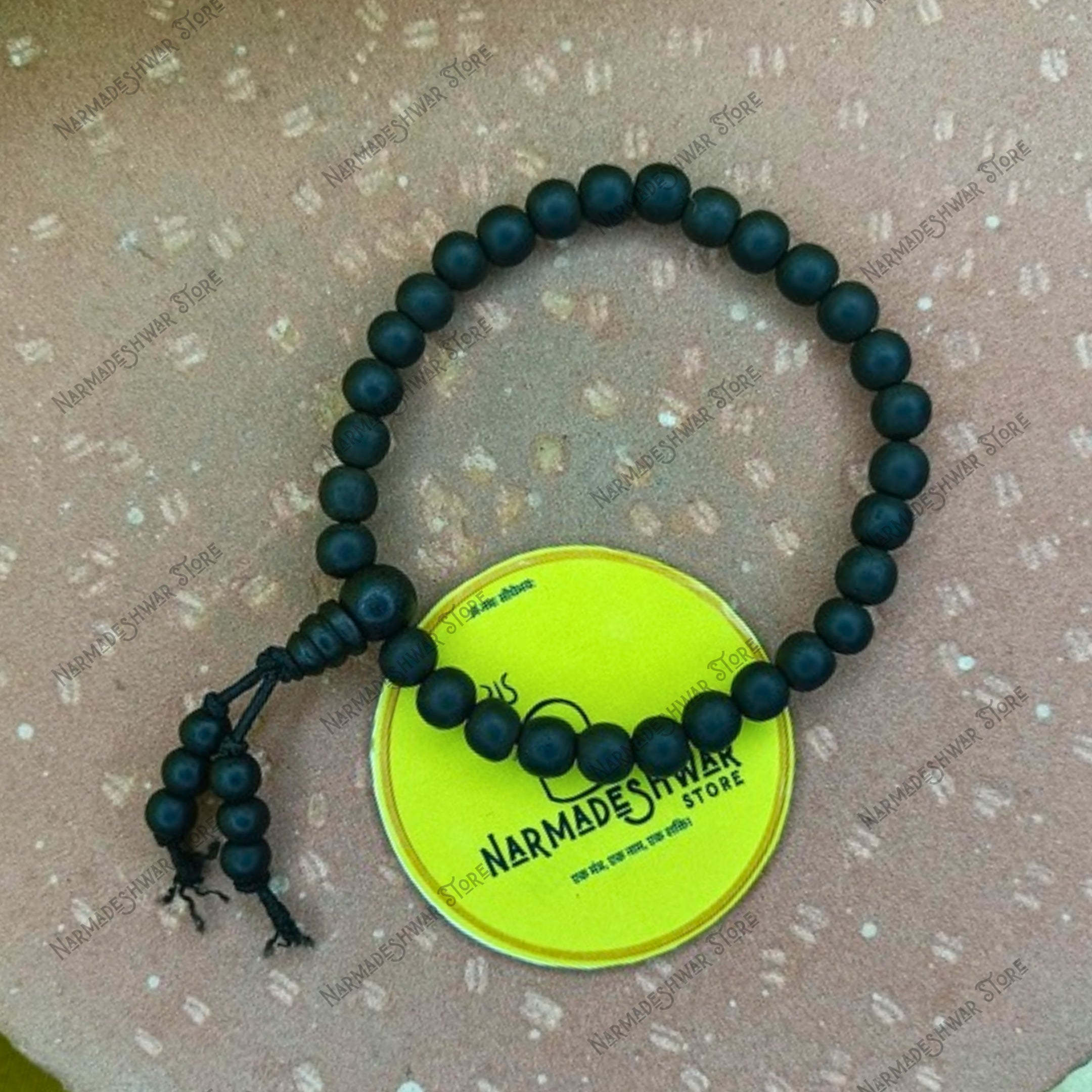 Close up of Karungali wood beaded protection bracelet