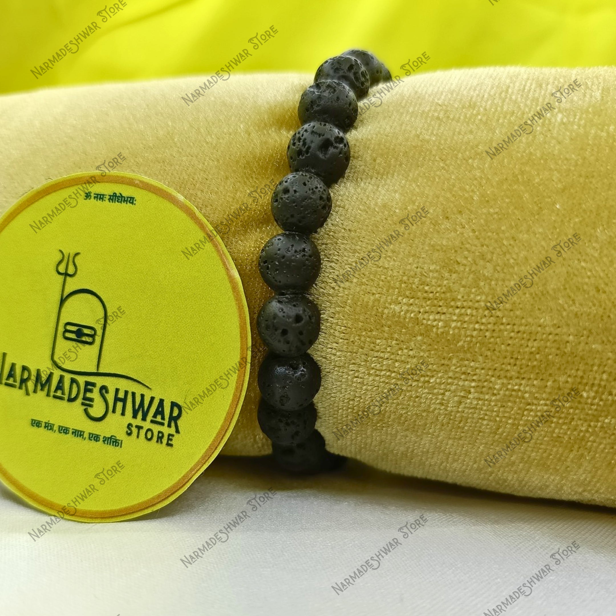 Lava Stone grounding bracelet close-up on yellow background
