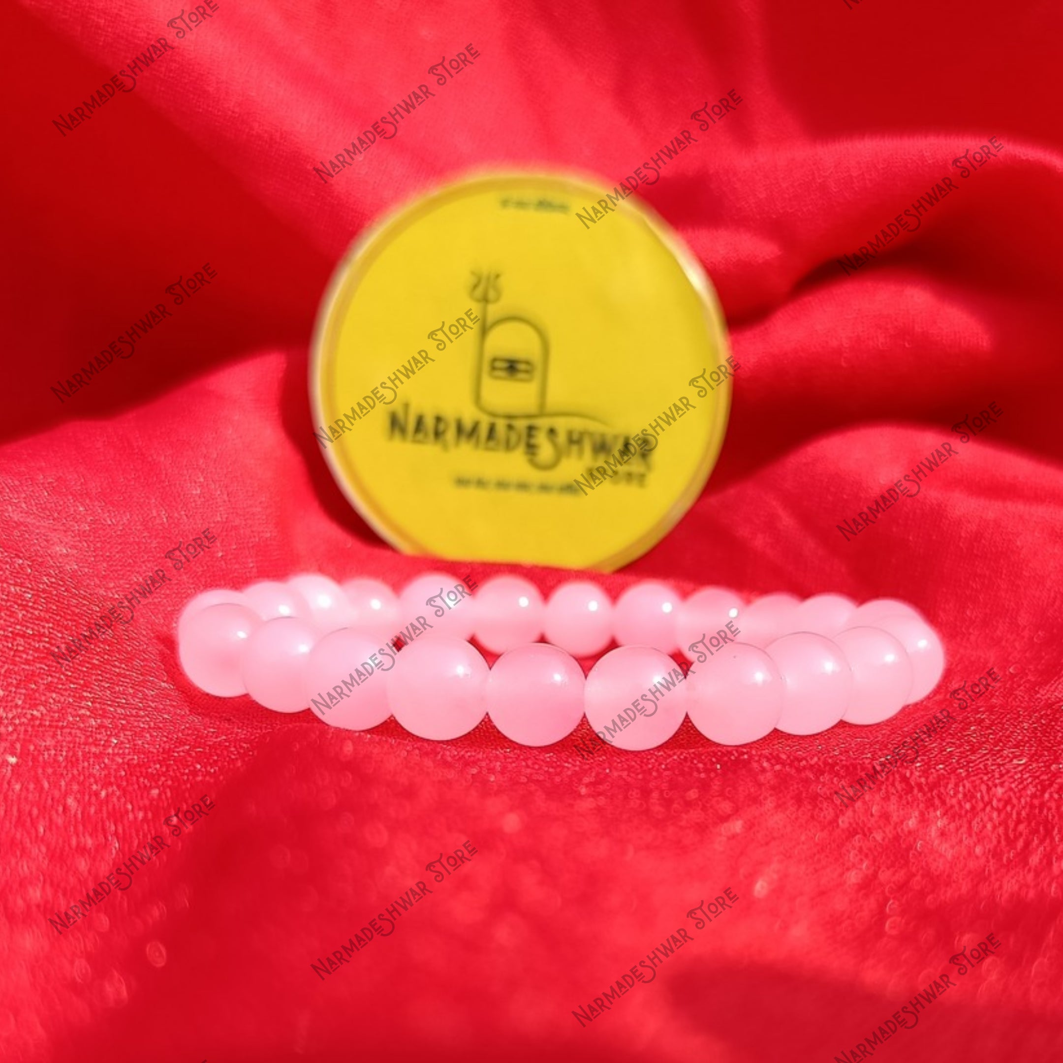 Rose Quartz Self Love Bracelet on red satin cloth with Narmadeshwar Store branding