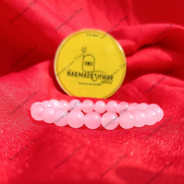 Rose Quartz Self Love Bracelet on red satin cloth with Narmadeshwar Store branding
