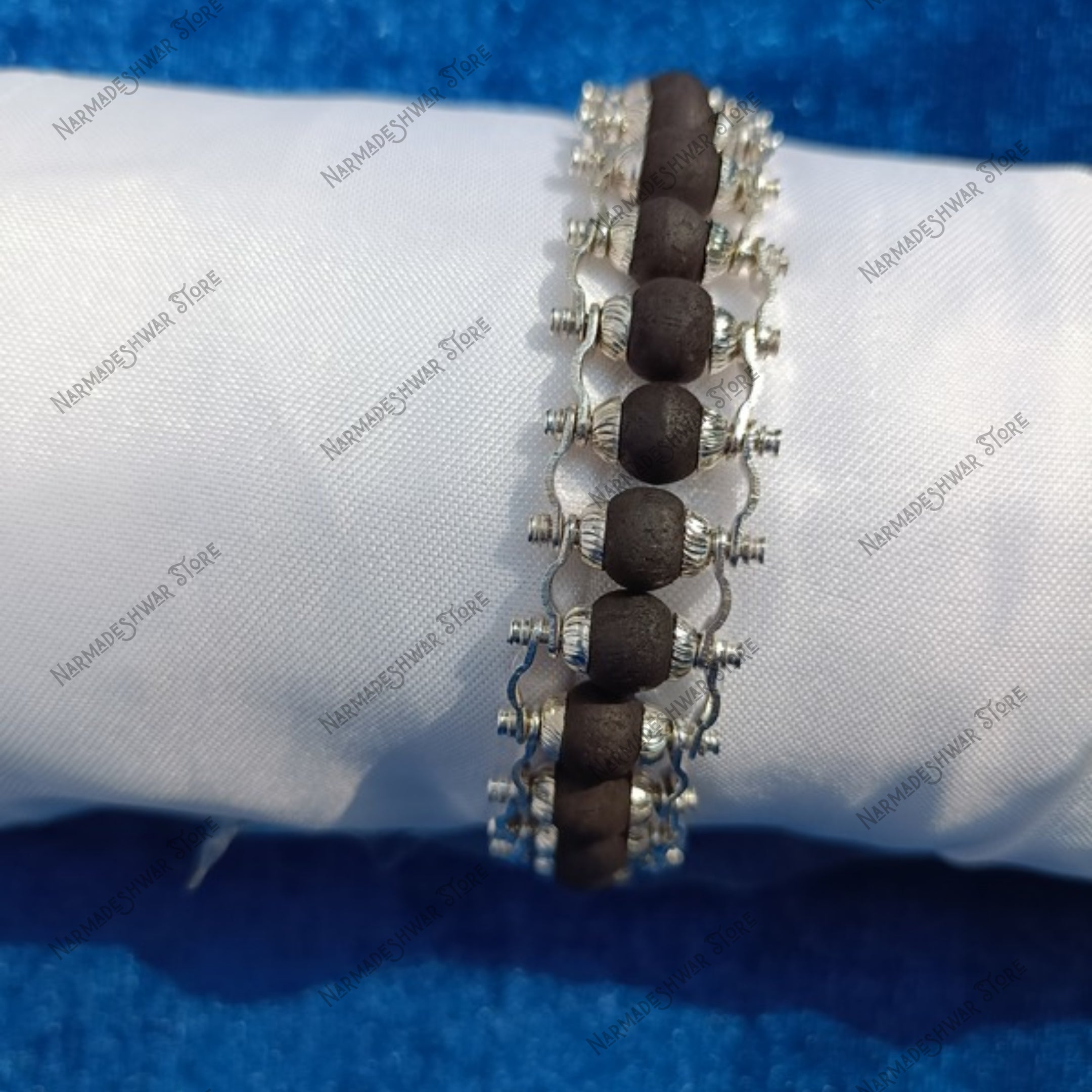 Close-up of Karungali Ebony Wood beads with silver plating