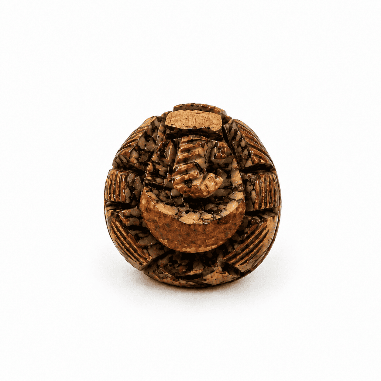 A round, carved brown decorative object with a textured, organic surface and raised central detail, photographed on a clean white background.