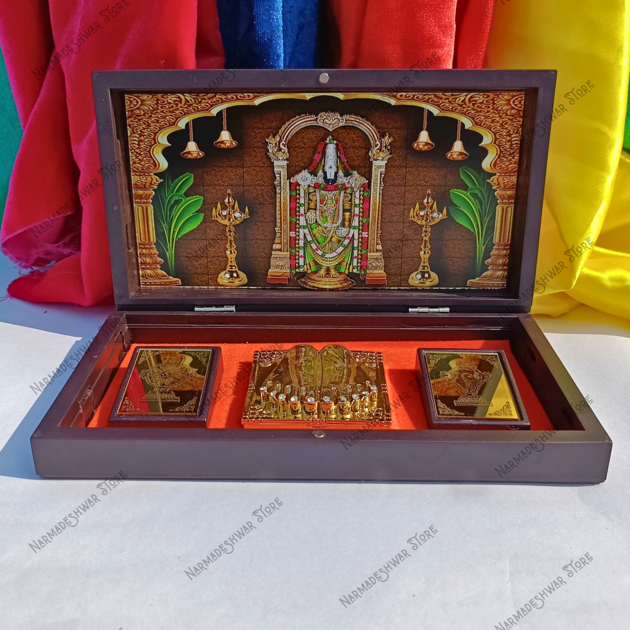 Tirupati Balaji Portable Pooja Temple with intricate designs and colorful elements on a multicolored fabric background.