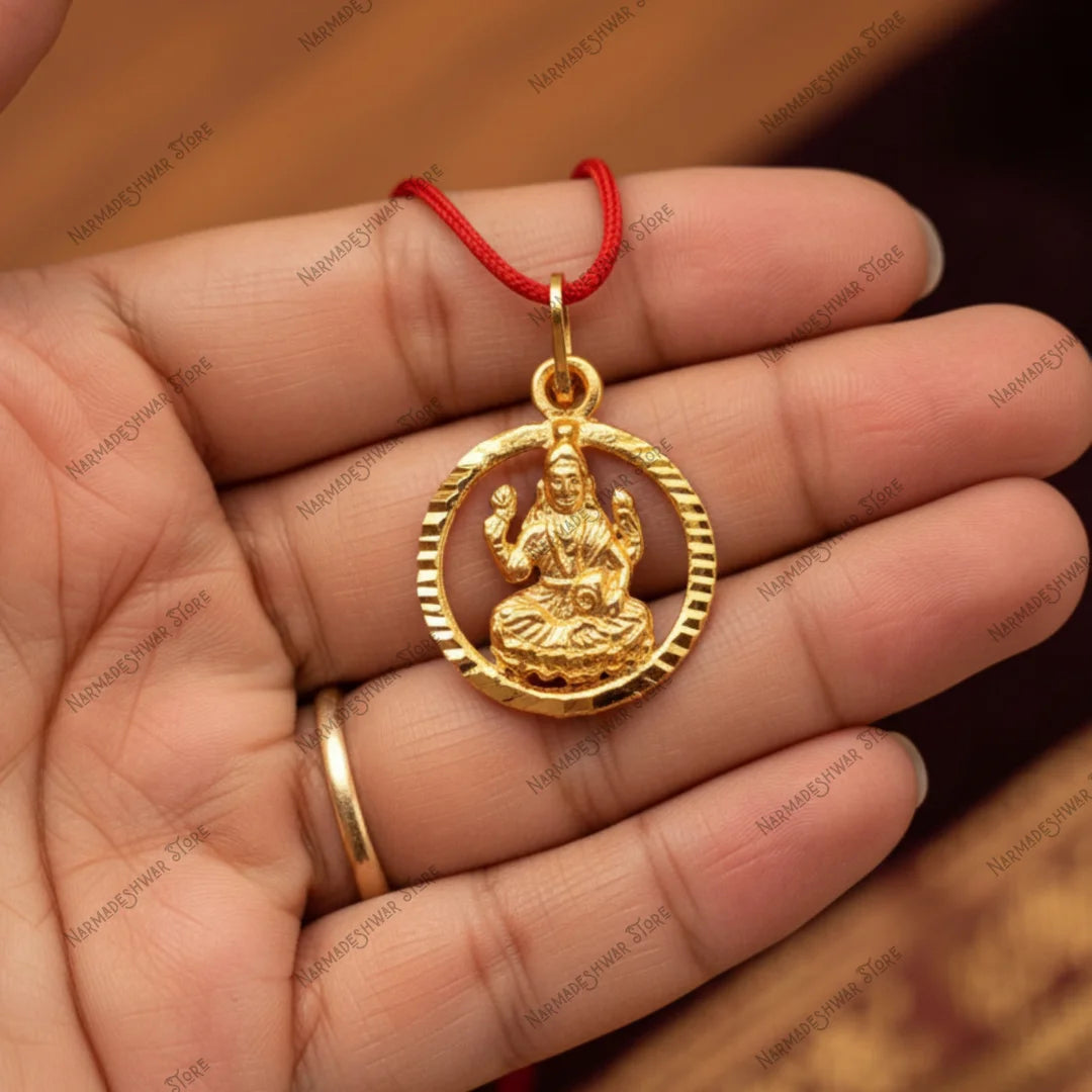 Lakshmi locket close-up in hand — gold plated prosperity pendant